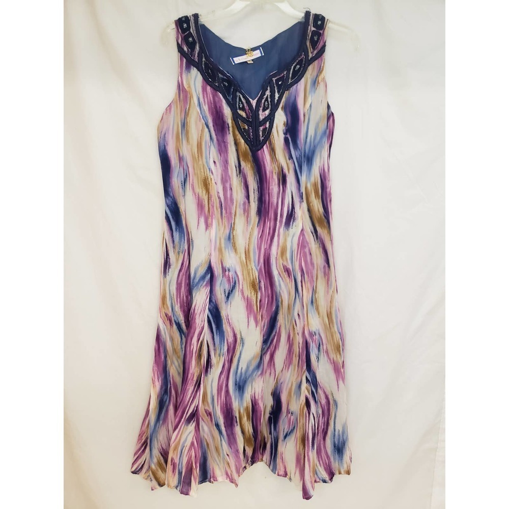 Size 8 sleeveless dress. Reba. Beading around neckline.